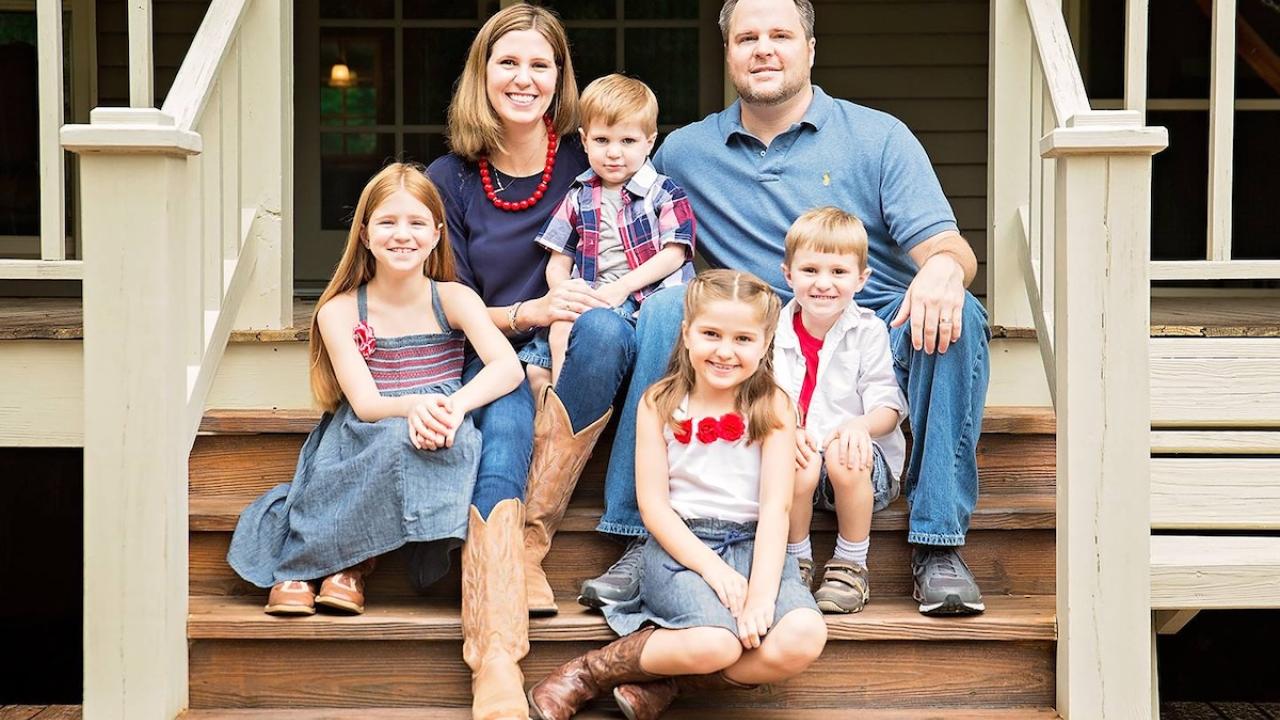 The Gossling family shown on the front porch of their home.