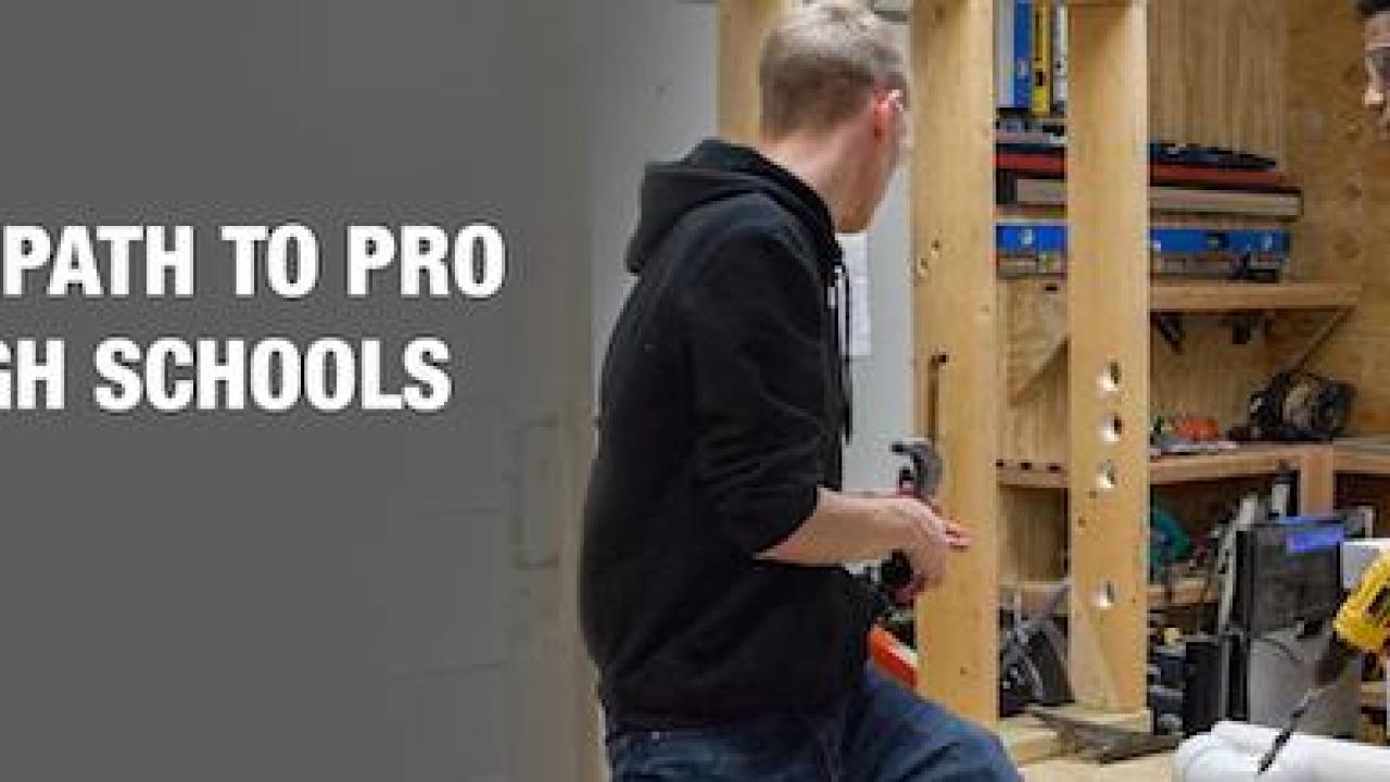 The Home Depot Foundation: Expanding Path to Pro to 250+ High Schools. Image of two male students (one black and one white) working on a carpentry project.