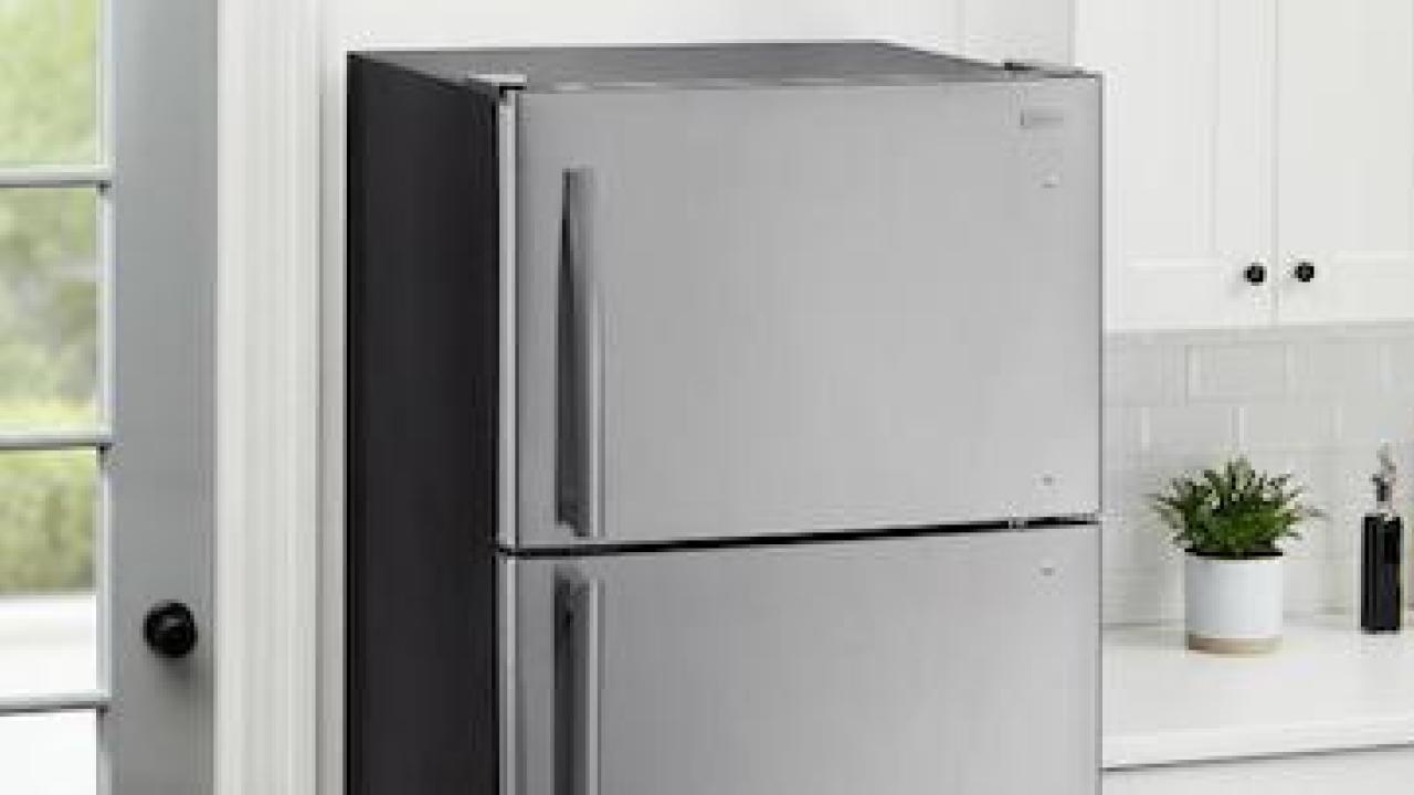 Photo of a refrigerator in a kitchen. The Home Depot Earth Month logo is shown.