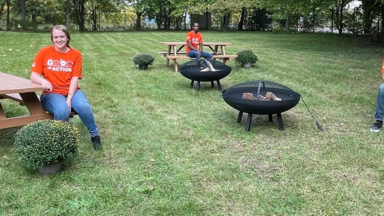 Home Depot Team members seated at picnic tables.