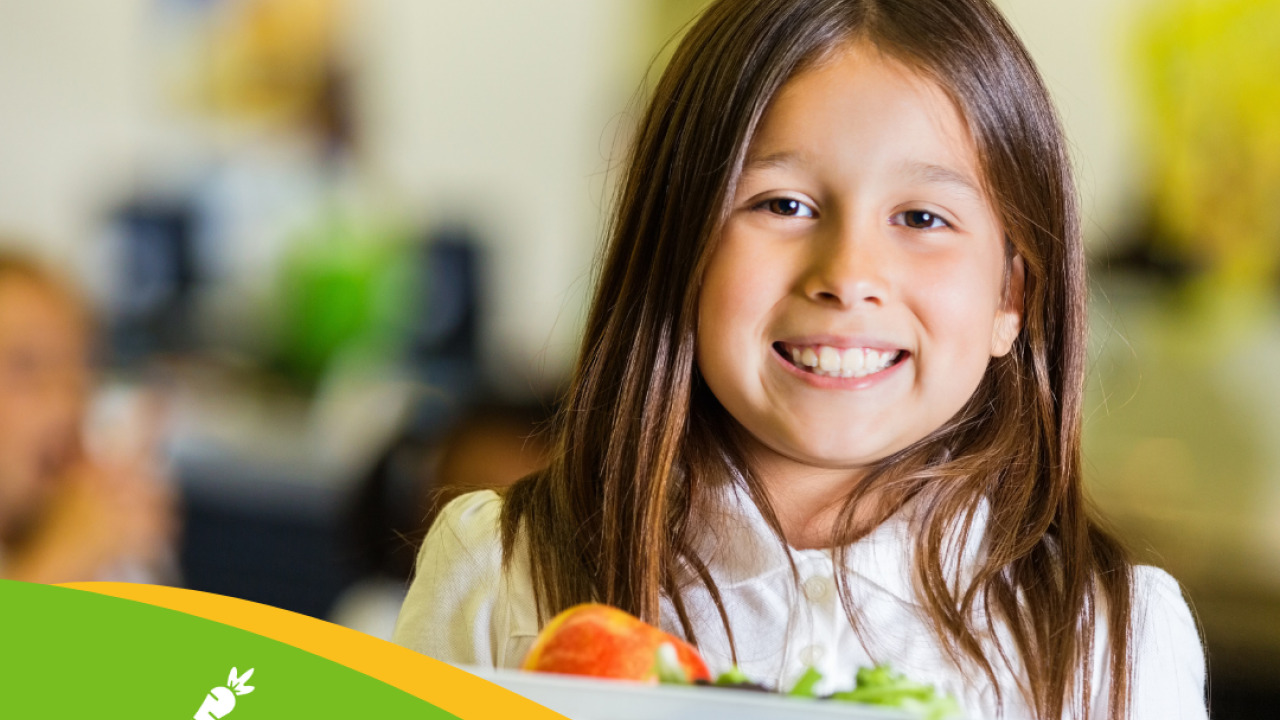 Girl getting food from cafeteria salad bar