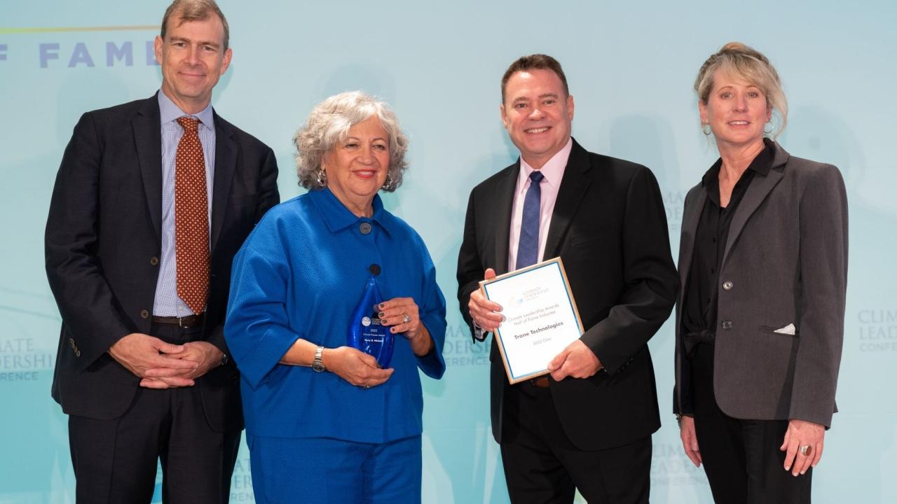 Scott Tew (second from right), Vice President, Sustainability and Managing Director of the Center for Energy Efficiency & Sustainability at Trane Technologies (CEES) accepts Trane Technologies’ induction into the Climate Leadership Awards Hall of Fame. He is joined on stage by Nathaniel Keohane (left) President of C2ES, Mary Nichols (second from left), 2022 Climate Pioneer Award winner, and Amy Holm (right), Executive Director of the Climate Registry.