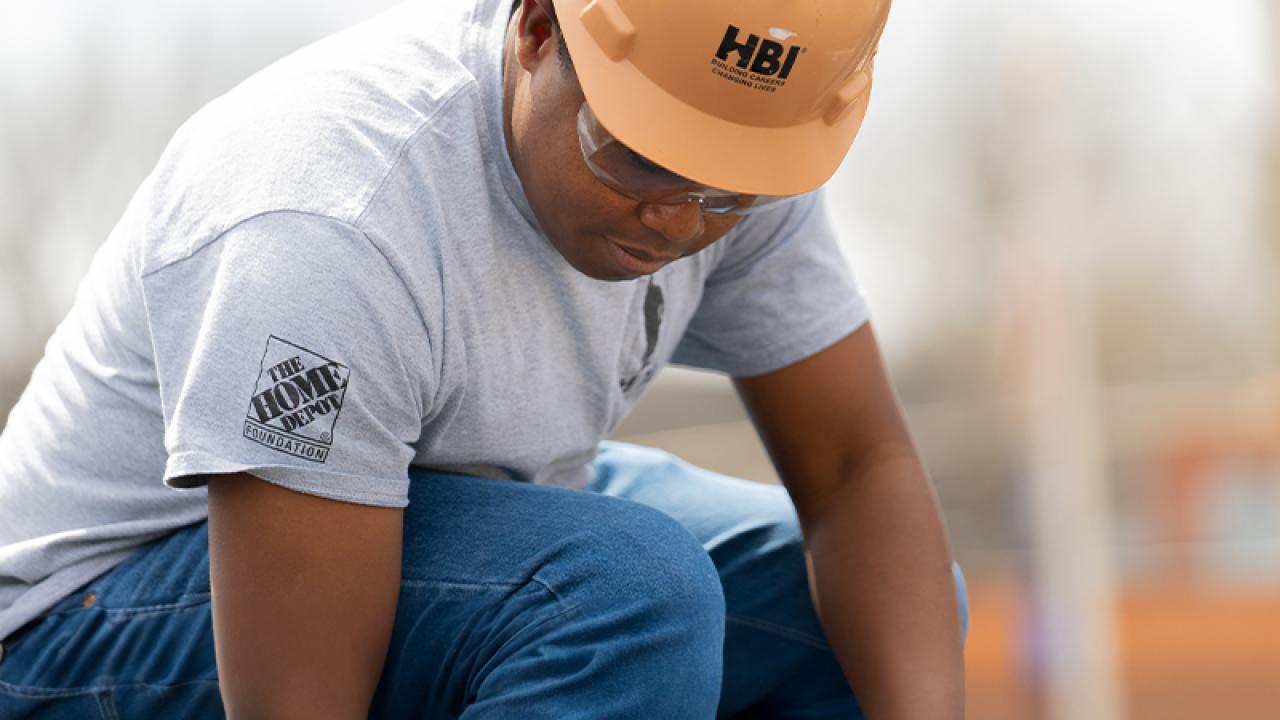 HBI and The Home Depot professional on a worksite.