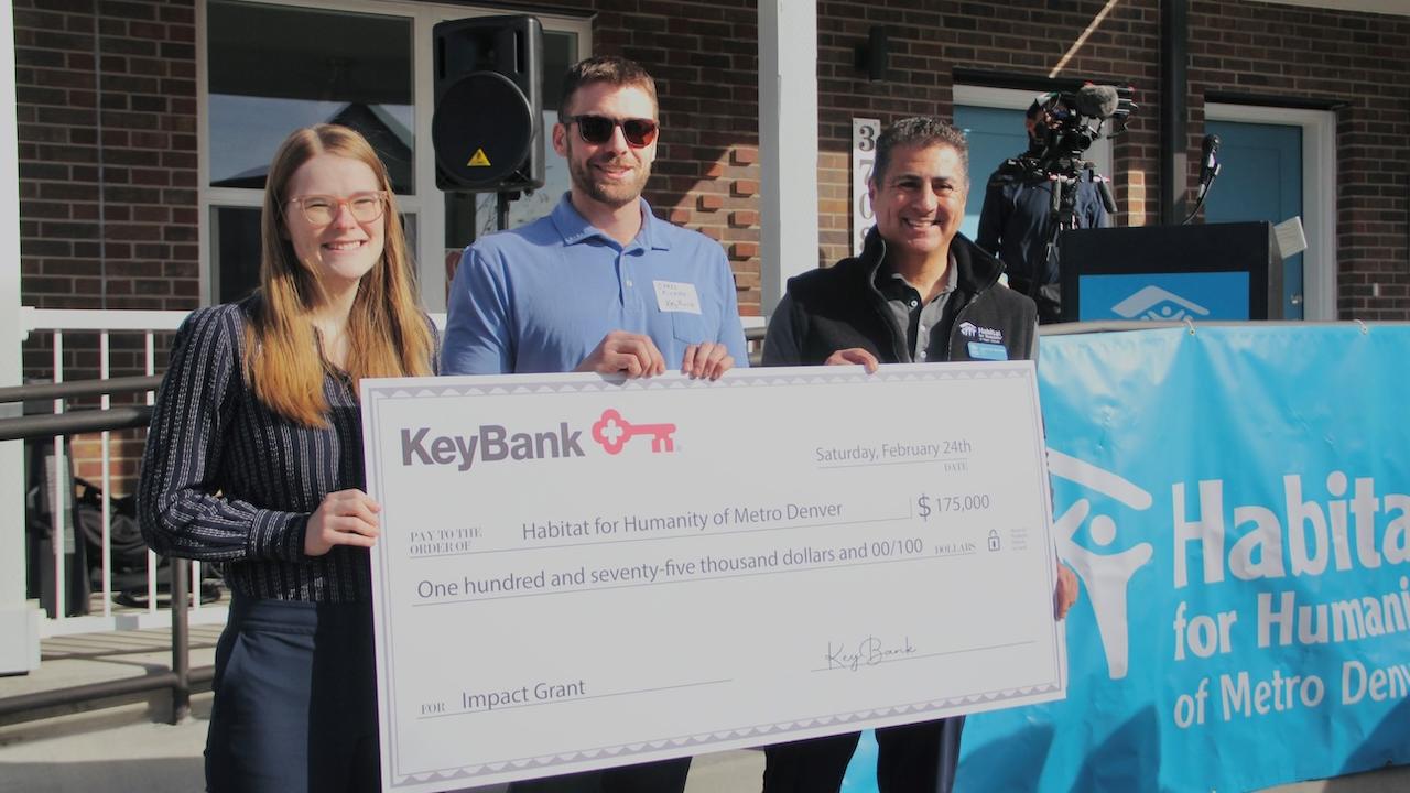 Team members from Habitat for Humanity shown with a $175,000 grant check from KeyBank.