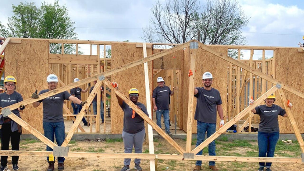 Group building a house