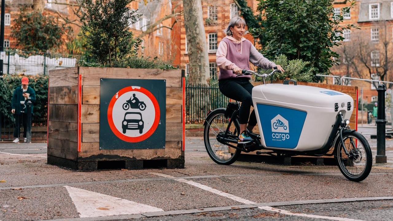 A person riding a cargo bike
