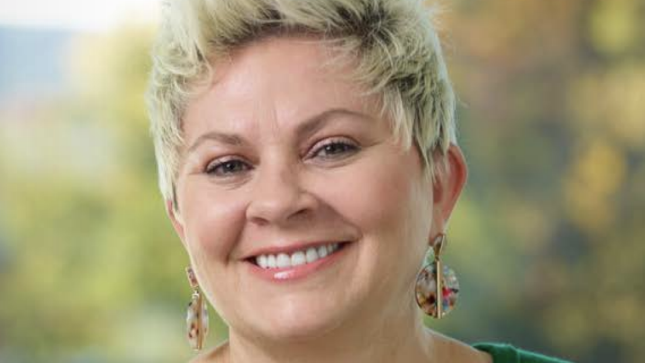 Headshot of a person smiling