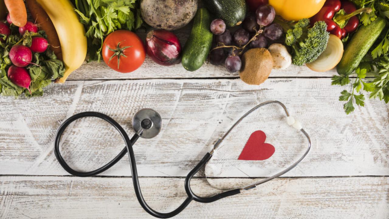 Fruit and vegetables shown with a stethoscope.