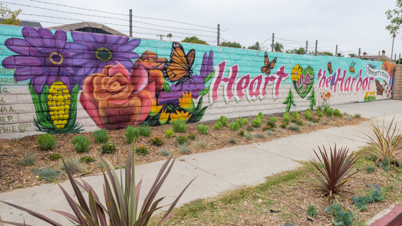 mural on a wall "Heart Harbor" with flowers, produce