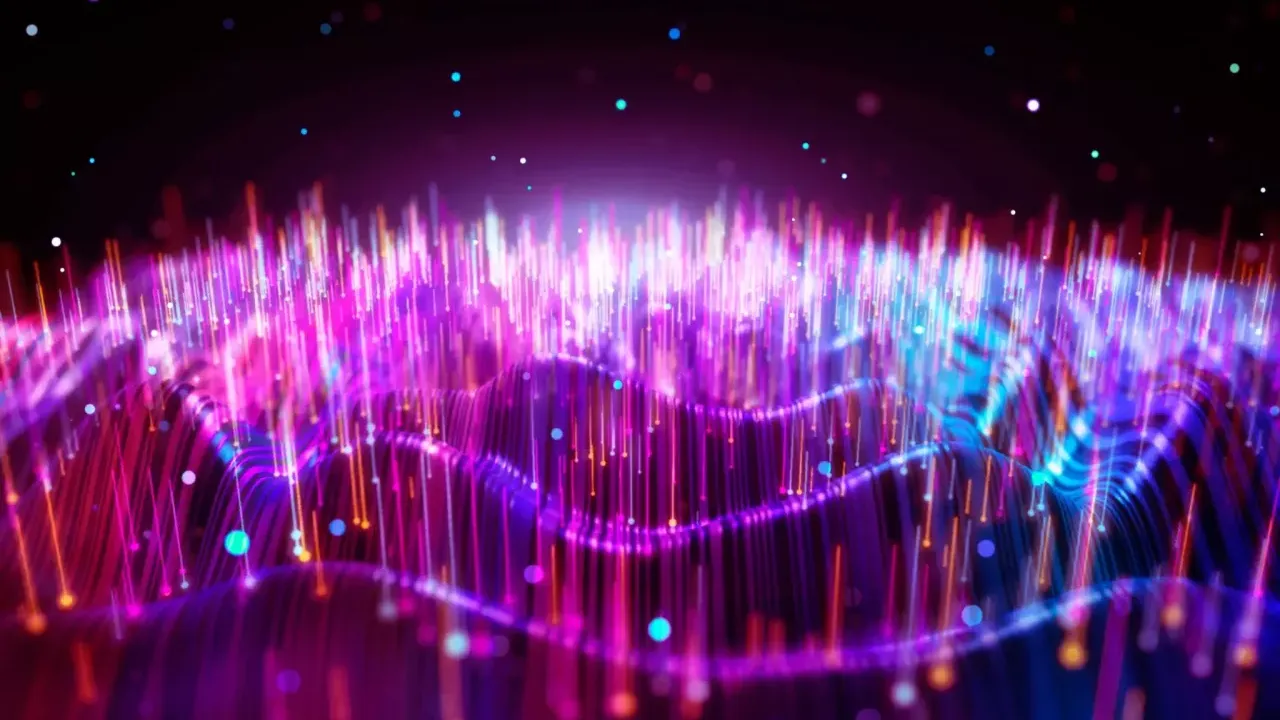 Abstract image of energy waves in red, purple, blues.