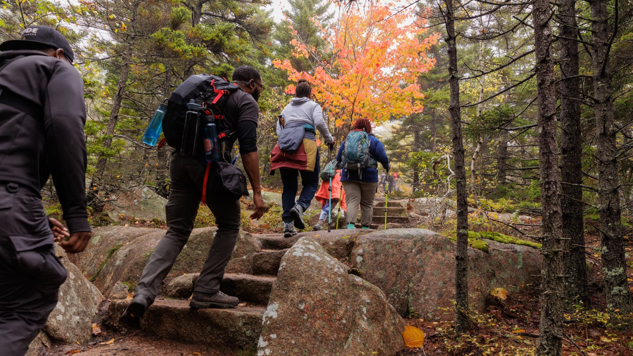hikers climbing rock stairs