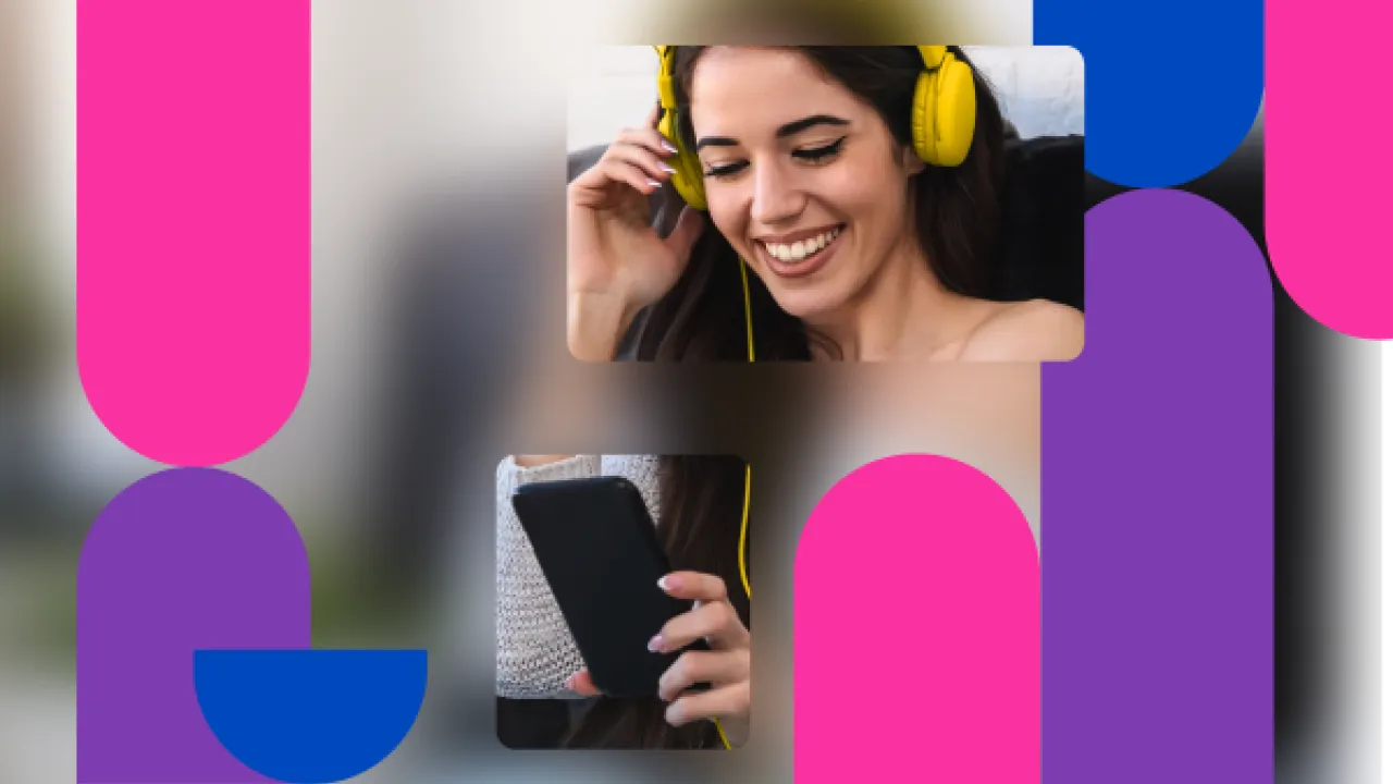 Young woman shown wearing headphones and looking at her phone.