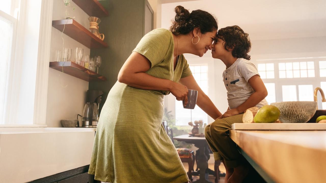 A mom and her son sharing a tender moment.
