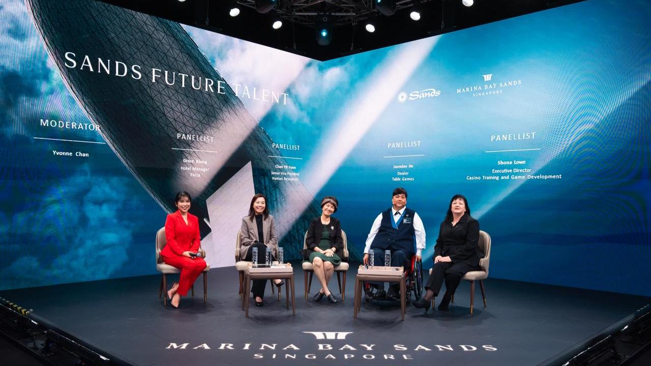 Five panelists seated together