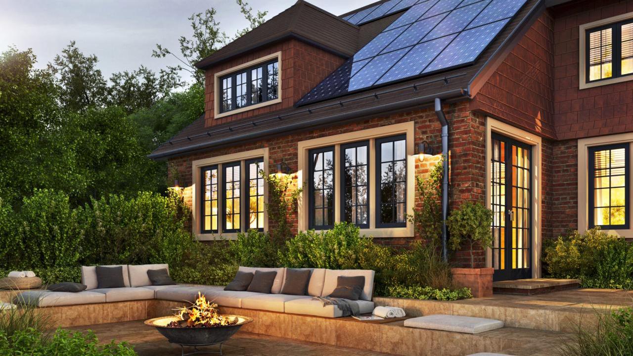 Exterior of a house with a fire pit in the backyard 