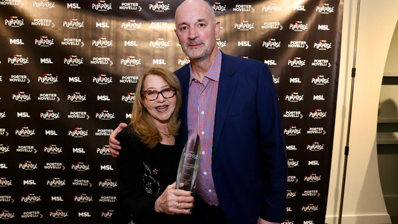 Carol Cone receiving award.