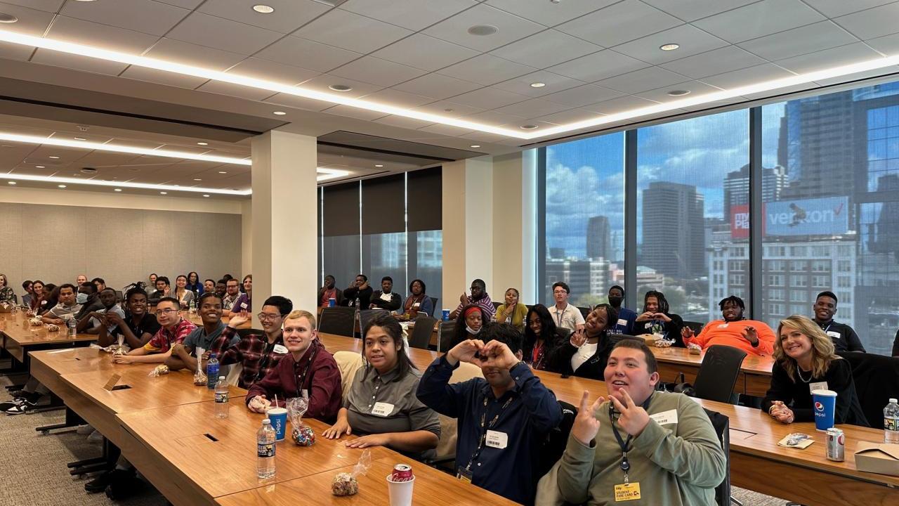 A.J. Drexel Autism Institute students pose for a picture in a conference room