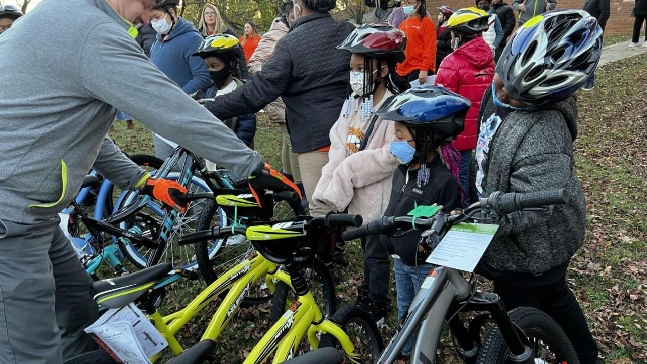 Kids in helmets with bikes