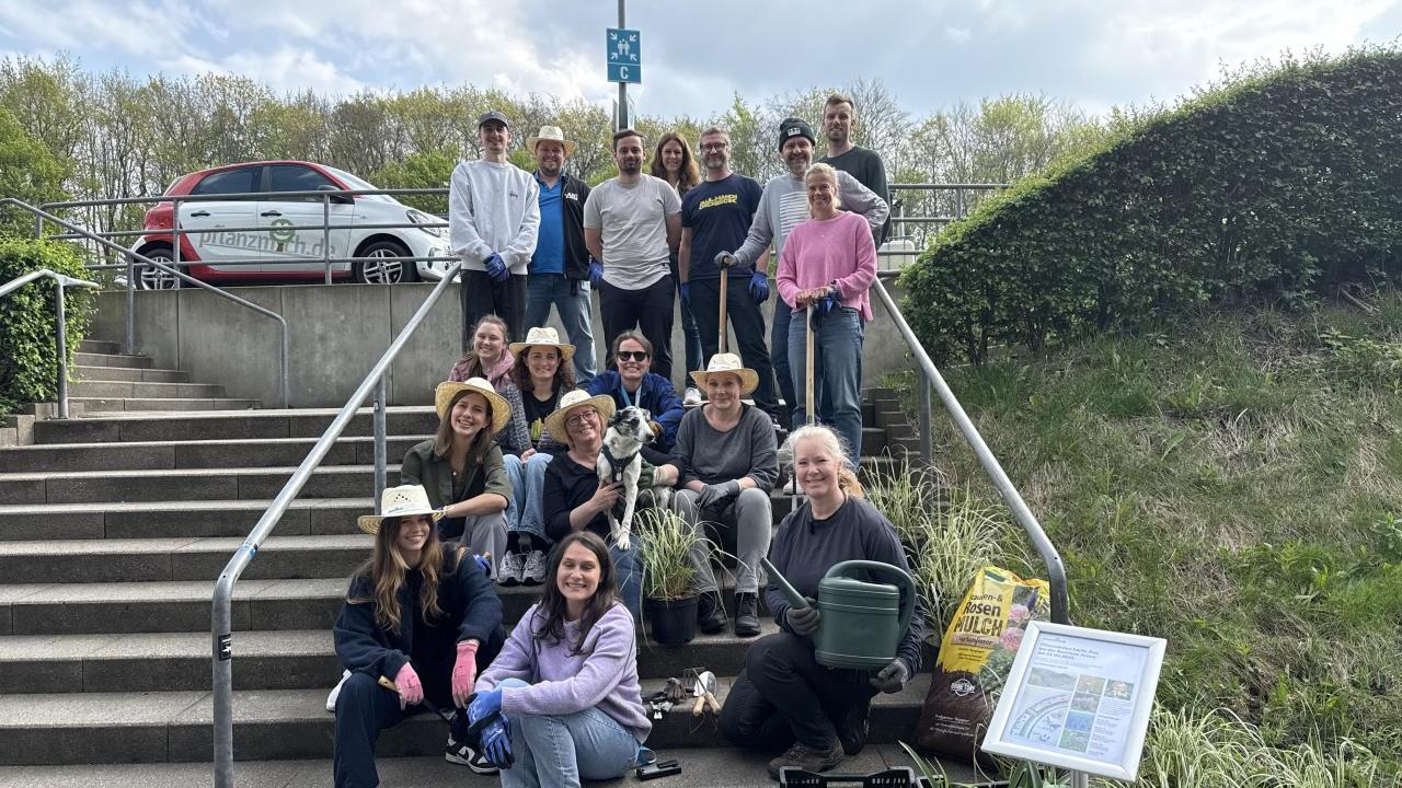 Equipped with shovels, gloves, and watering cans, the group spent the day planting a total of 412 new plants and sowing flower seeds.