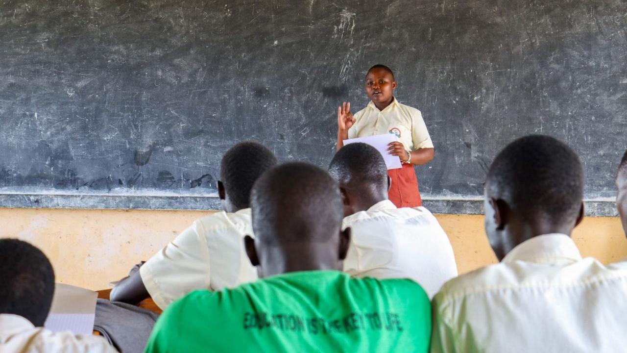 Patience teachers her club about nutrition.