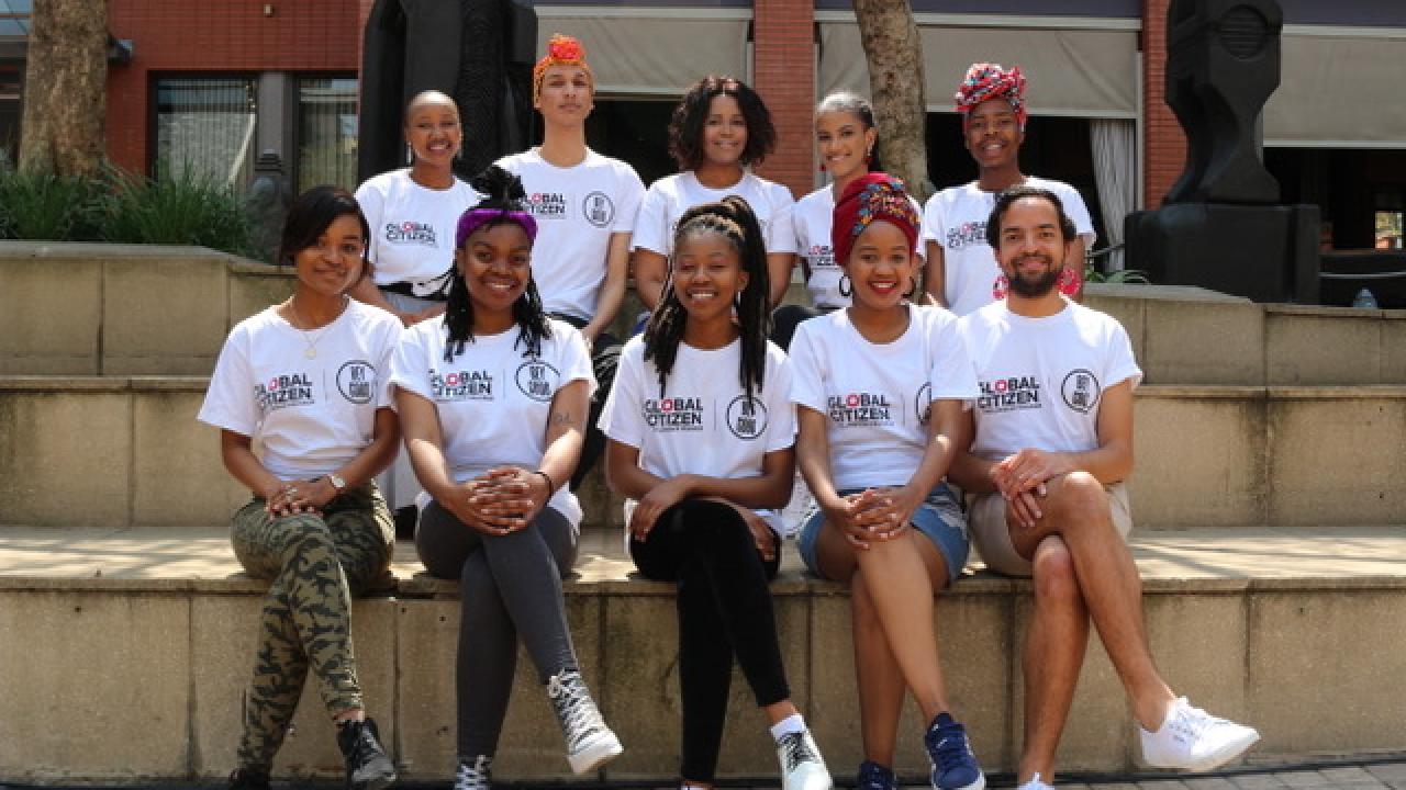 Group of fellowship program participants sitting on steps together 