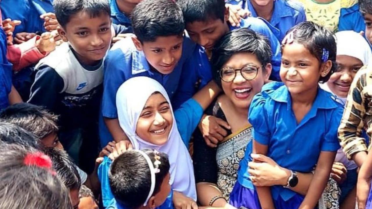 Young students in Bangladesh shown with their teacher.