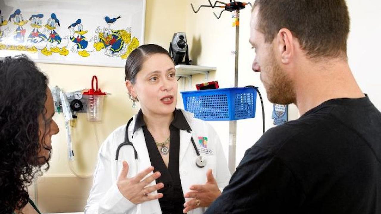Dr. Lina Basel-Salmon consulting with two patients.