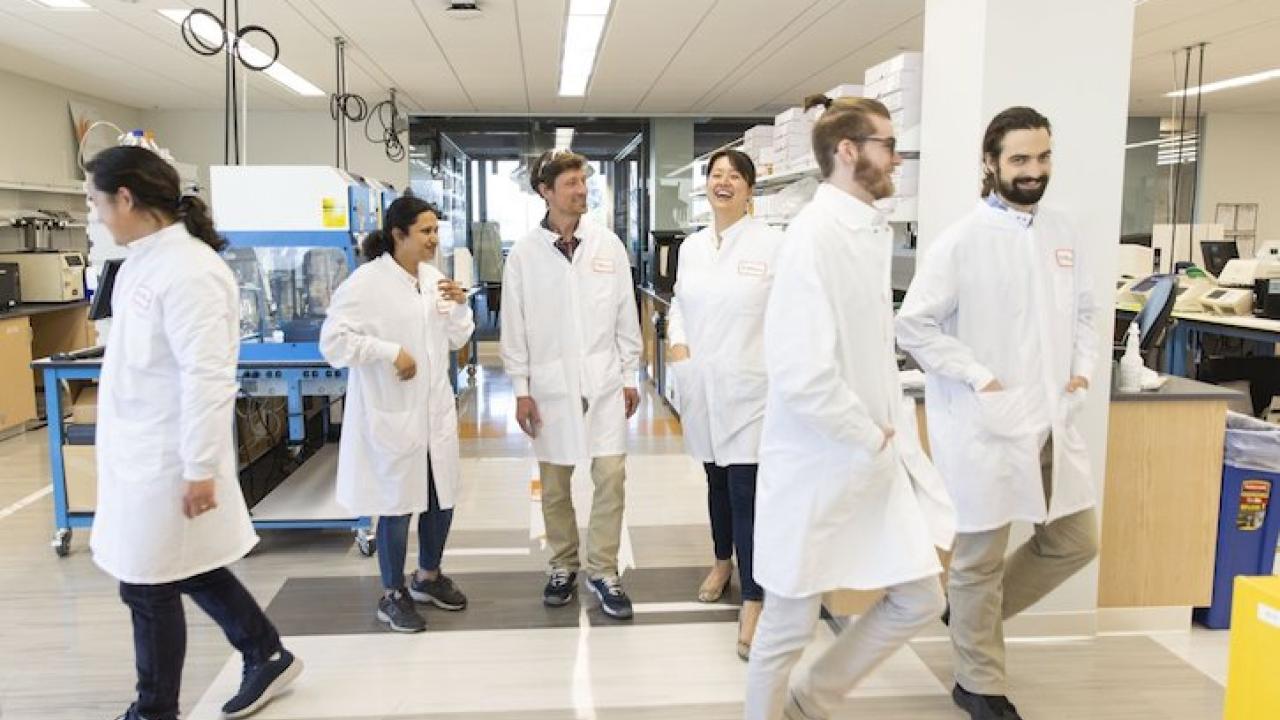 Illumina technicians in a lab.