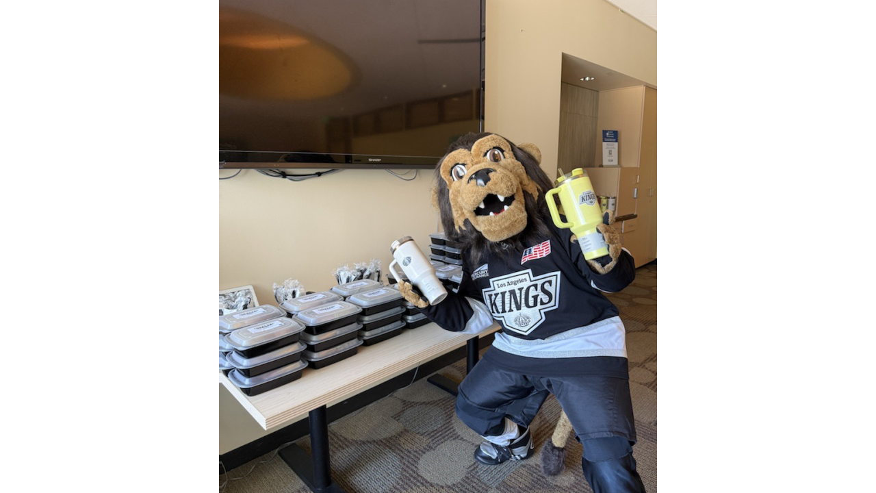 Los Angeles Kings Mascot Bailey posing in front of SuperFd meals
