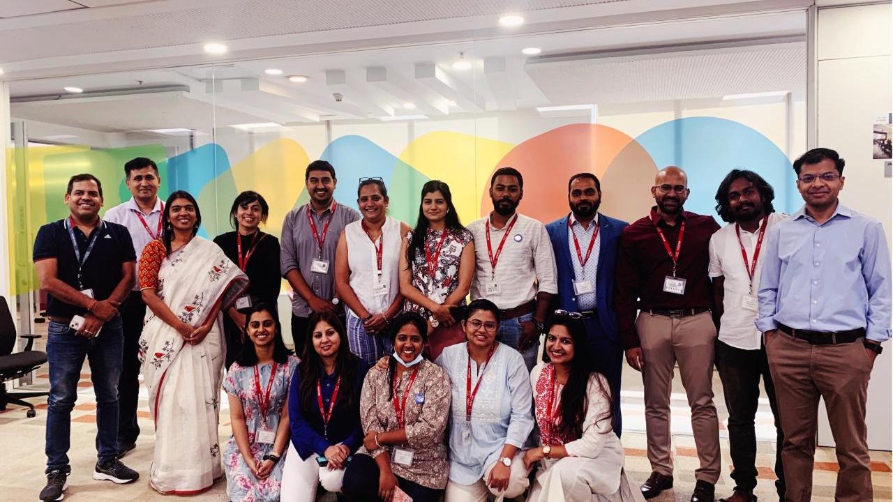 A team of people with matching lanyards.