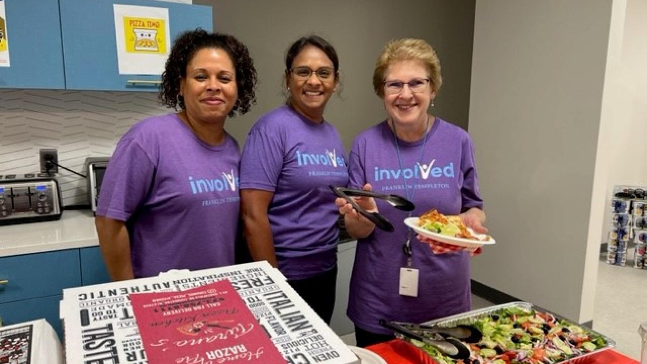 Three Short Hills volunteers serving food