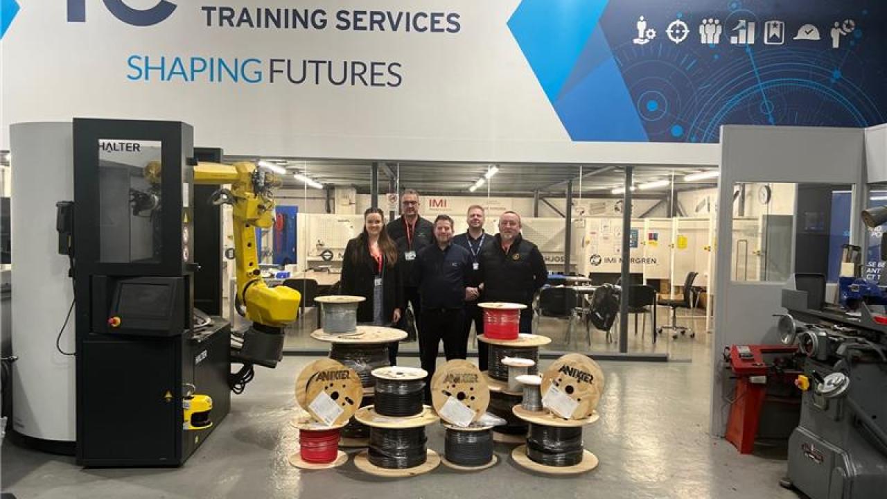From left to right: Sophie Whitfield, Sean Tully, Paul Hodgetts, Simon Wood and Allan Mitchell with the donated cable at In-Comm training Walsall. 