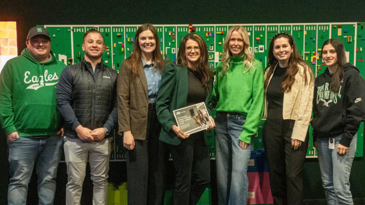 Members of the Eagles Autism Foundation, the Tork Coalition for Inclusive Hygiene, and the Philadelphia Eagles organizations meet at Lincoln Financial Field to plan the restroom upgrade execution. 