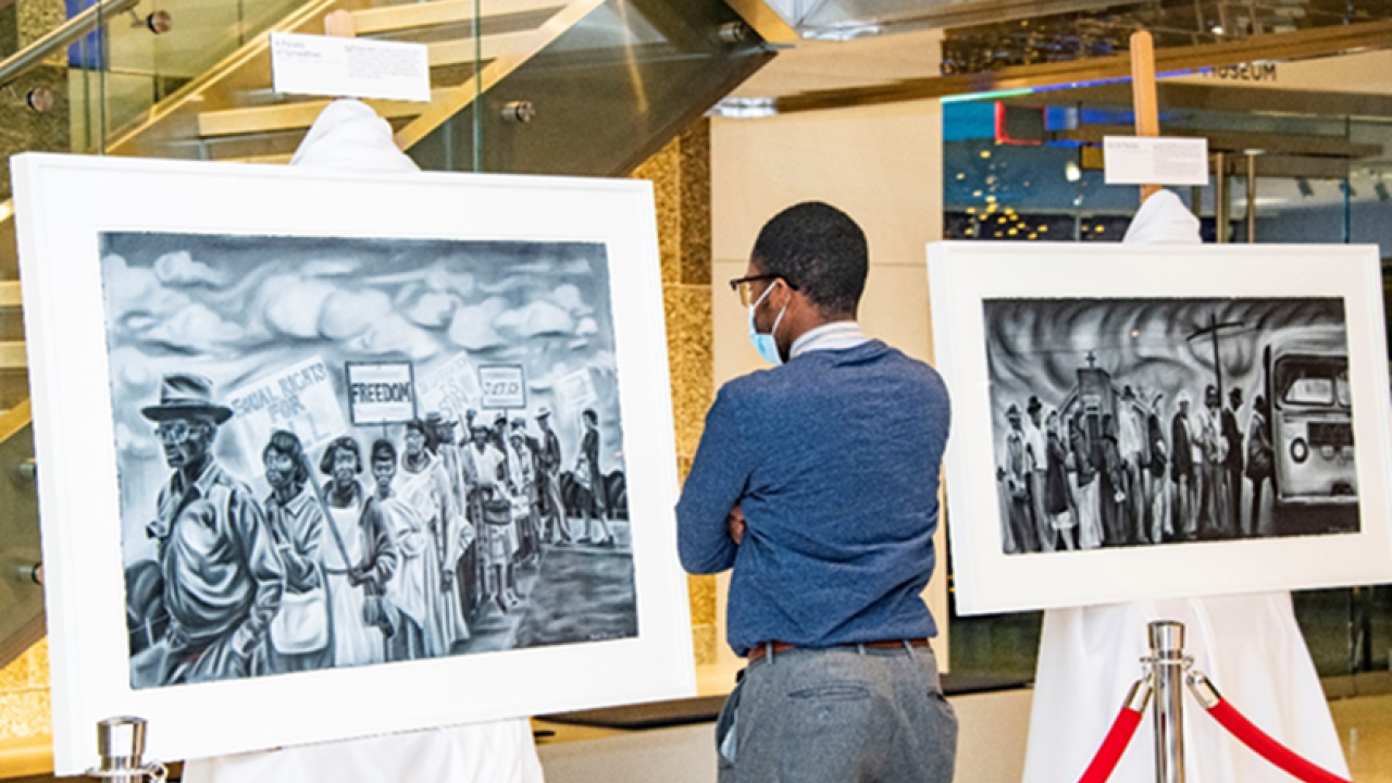 Man looking at artwork