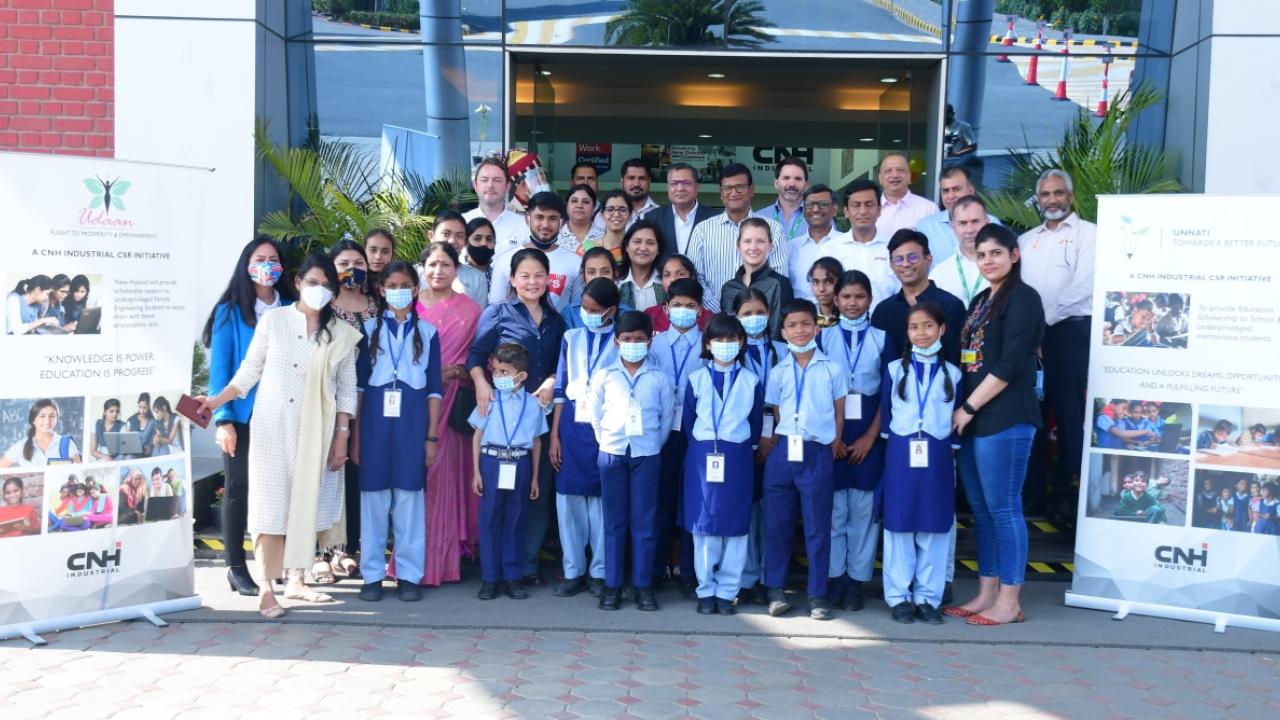 Class of students standing outside a school