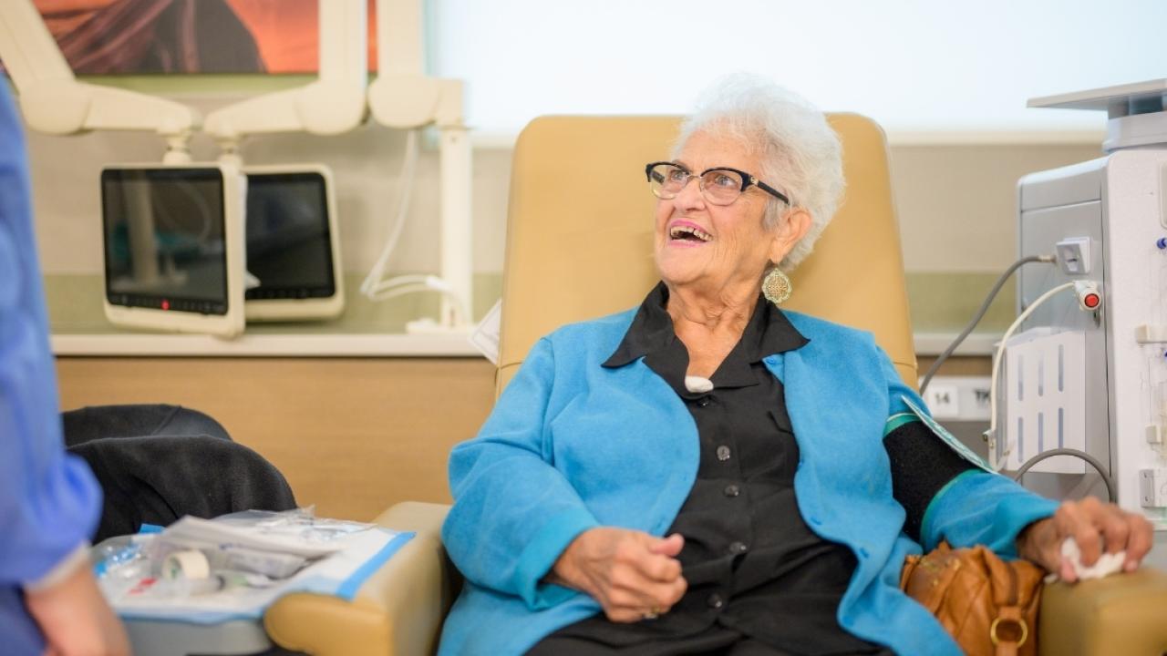Elderly patient speaking to healthcare provider