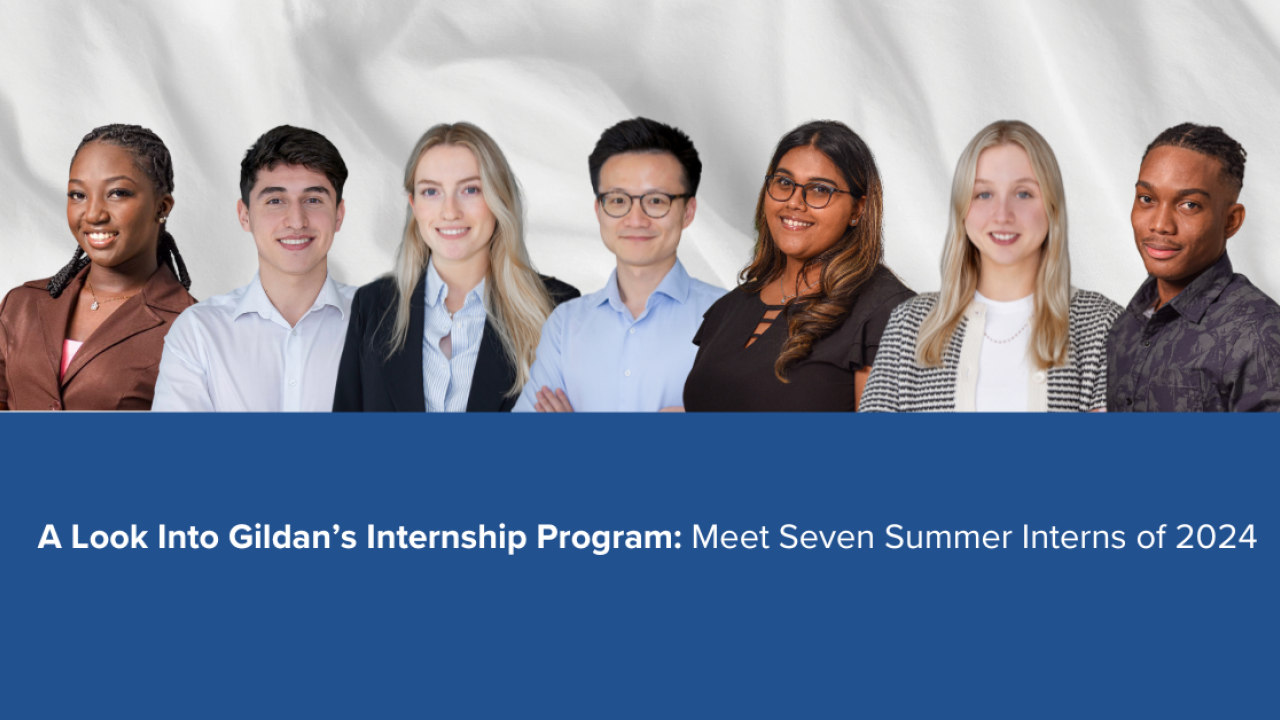 Seven interns pictured in front of a white fabric and blue background