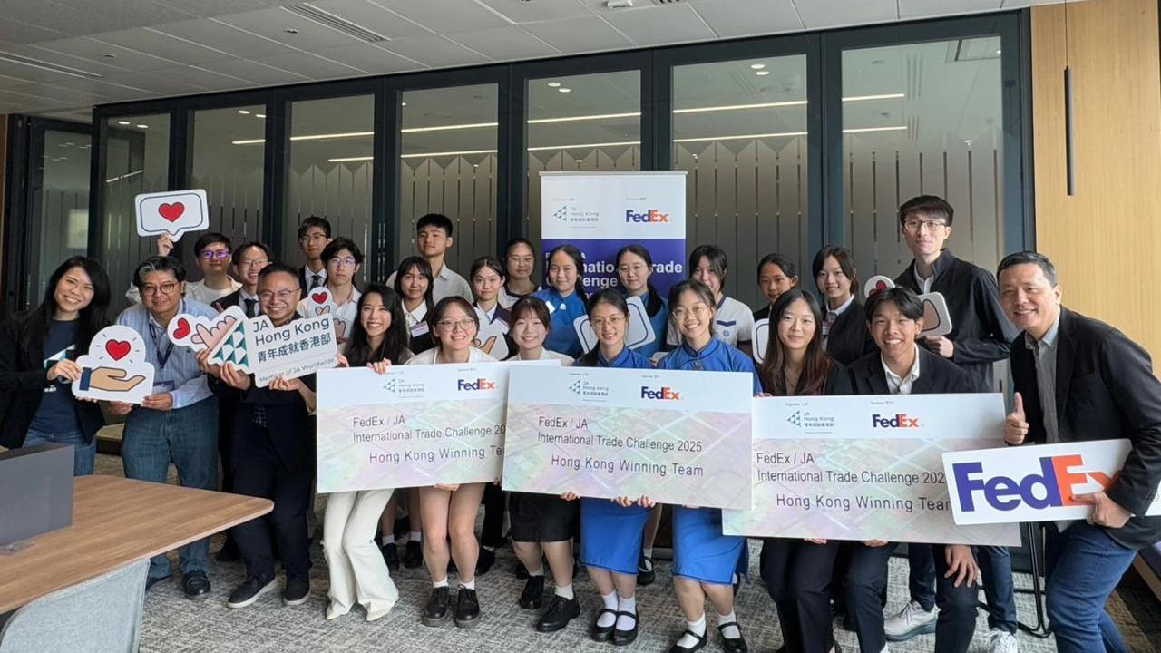 Group of students holding FedEx awards