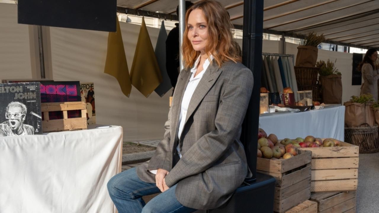 Designer Stella McCartney shown seated on a JBL Speaker in her Sustainable Market.