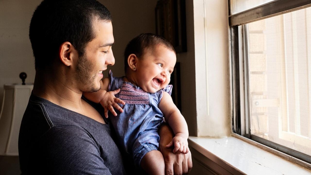 man holding baby