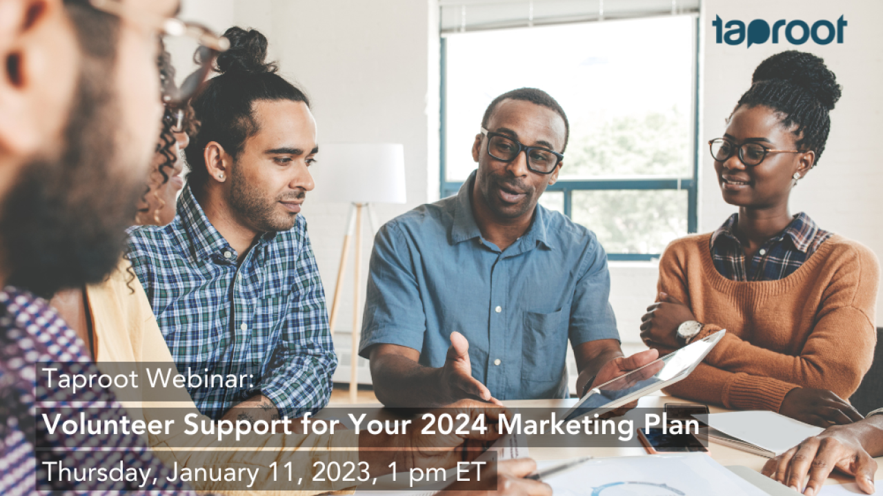 A professional team sits around an indoor table, listening to their colleague speak. Text overlay shares information on Taproot's free webinar on marketing pro bono.