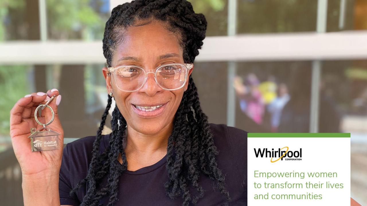 Janetta holding up house keys. "Whirlpool. Empowering women to transform their lives and communities."