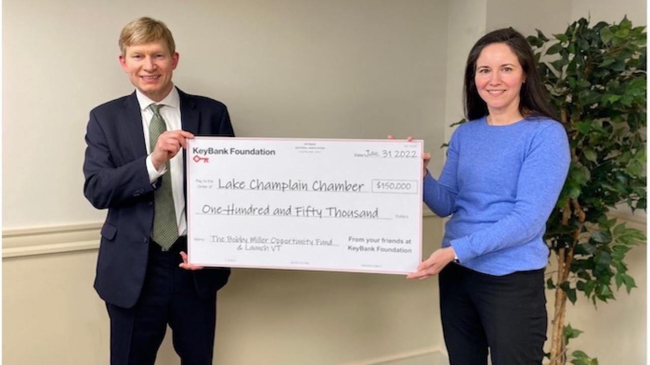 Photo caption: KeyBank Vermont Market President Don Baker presents a grant for $150,000 to Lake Champlain Chamber President Cathy Davis to support the Bobby Miller Opportunity Fund and LaunchVT. Photo credit: KeyBank 