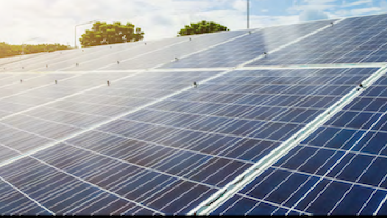 Solar panels against a blue sky.