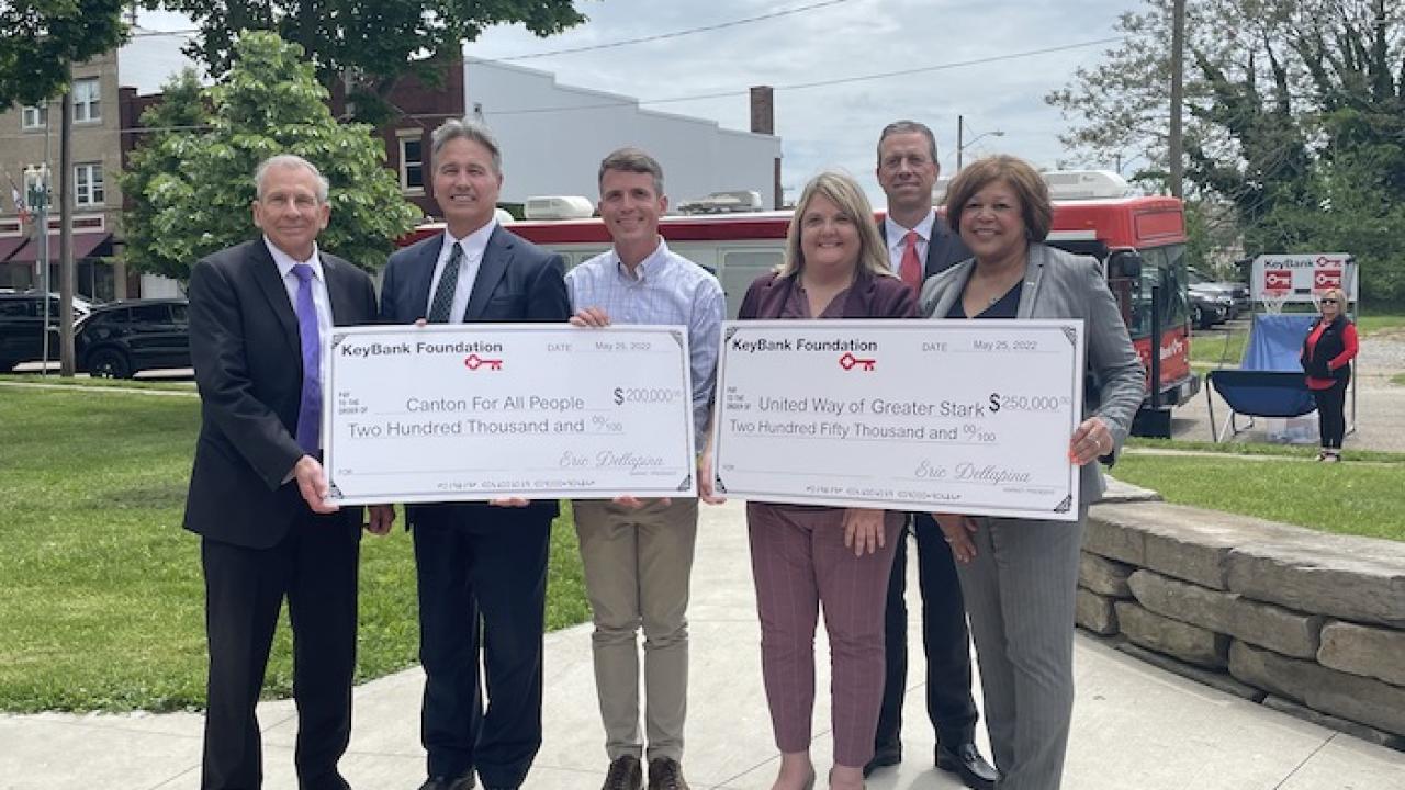 KeyBank Regional Sales Executive Tim Burke (second from right) along with KeyBank East Ohio Market President Eric Dellapina (far left) KeyBank Regional Retail Leader Becky Talley (far right) and Canton City Mayor Thomas Bernabei (far left) present Executive Director of Canton for All People Don Ackerman (third from left) with $200,000 grant and President and CEO of United Way Angela Perisic (third from right) with $250,000 grant.   