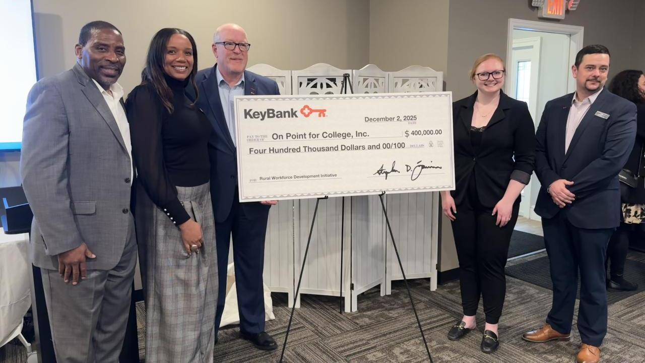 People holding an oversized check