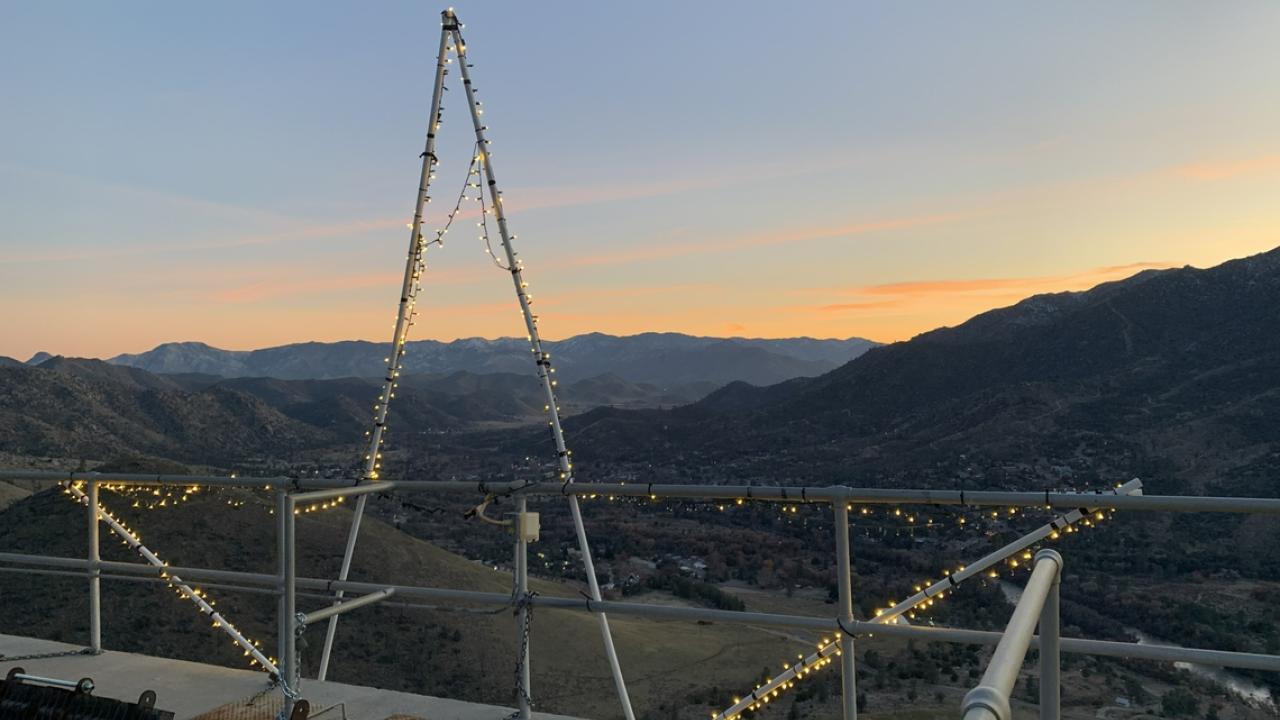A panoramic view of a valley at sunset. 