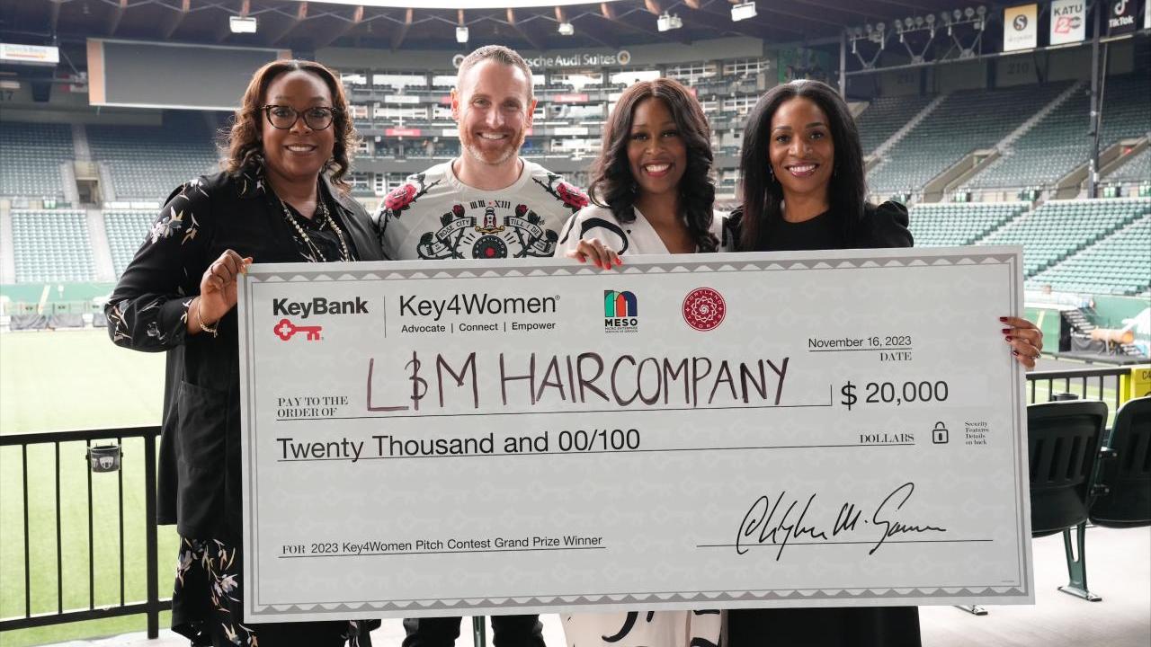 Key4Women Pitch Contest winners shown with a $20,000 check.
