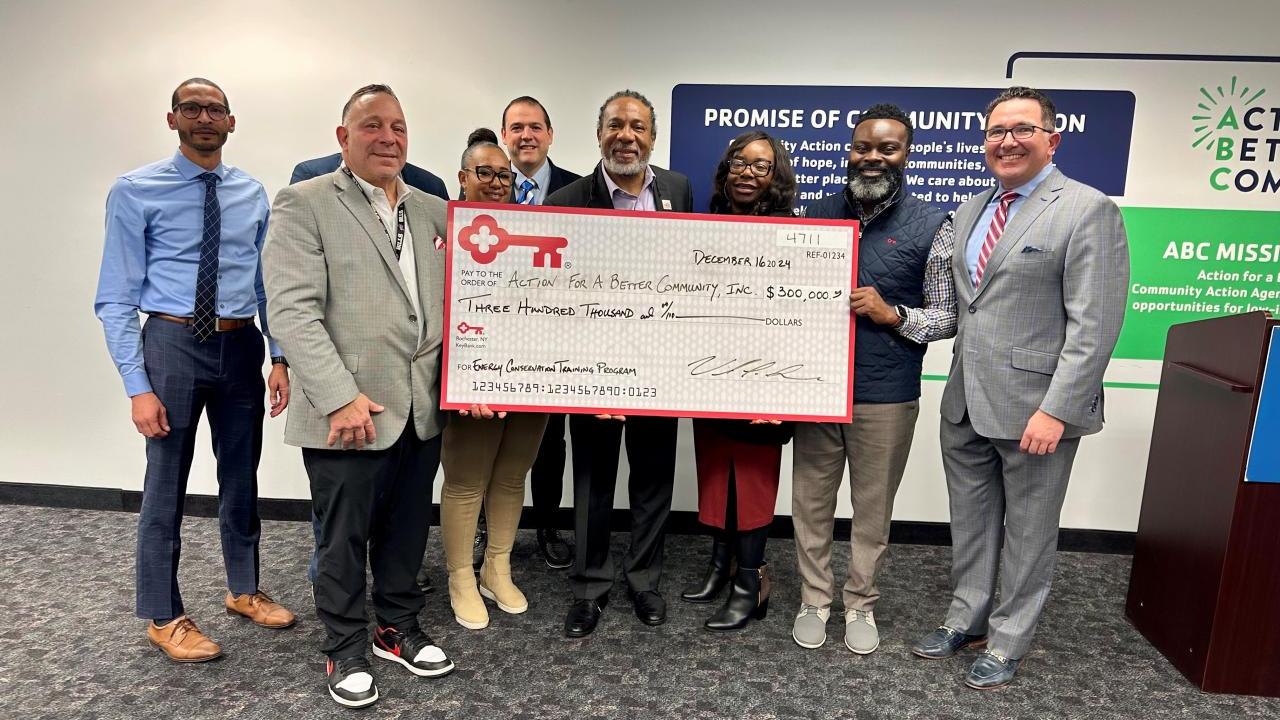 Representatives from The KeyBank Foundation and ABC Inc. shown with a  grant check for $300,000.