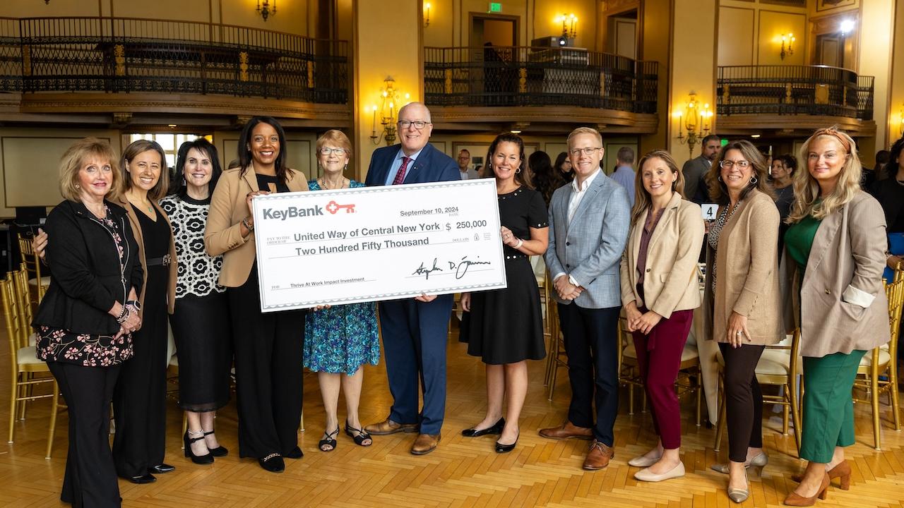 Representatives from KeyBank and United Way of Central New York shown with a grant check for $250,000.